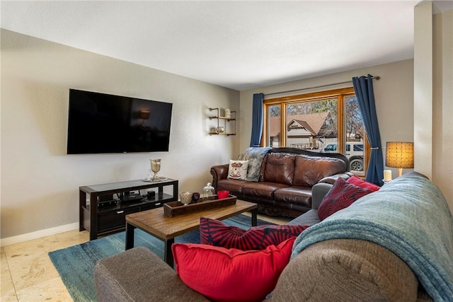 living room featuring baseboards