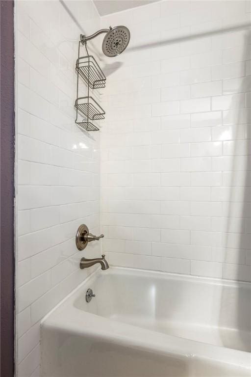 bathroom with shower / tub combination