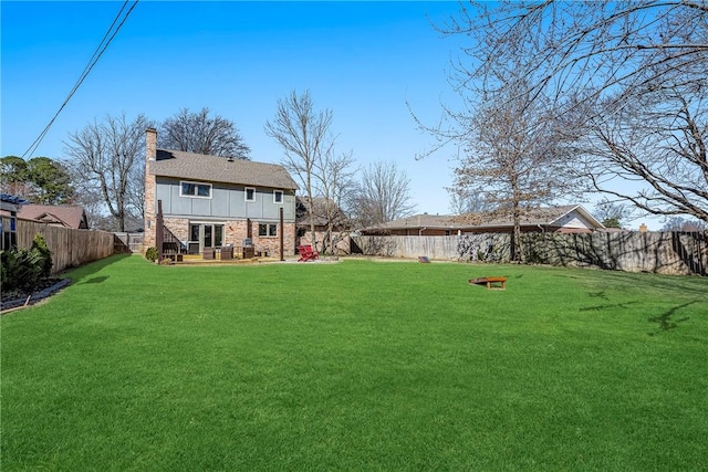 view of yard with a fenced backyard