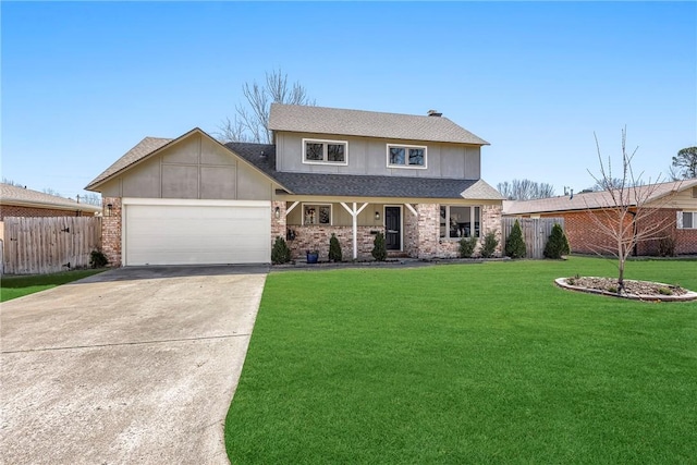 traditional-style house featuring driveway, an attached garage, a front yard, and fence