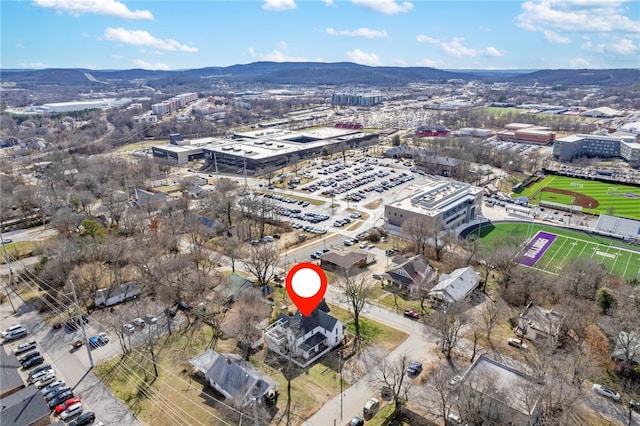 birds eye view of property with a mountain view