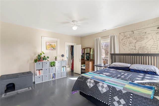 bedroom featuring visible vents, ceiling fan, and wood finished floors