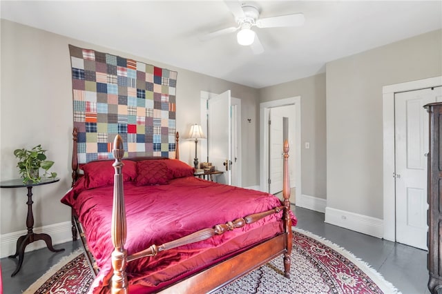 bedroom featuring baseboards, concrete floors, and ceiling fan