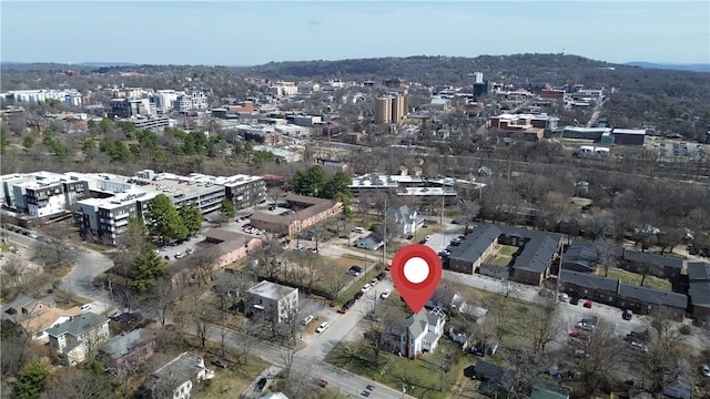 birds eye view of property with a city view