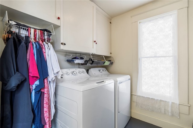 laundry area with cabinet space and independent washer and dryer