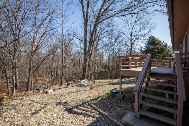 view of yard featuring a deck and stairway