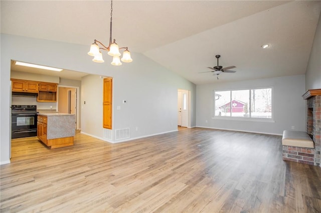9 Cromer Dr, Bella Vista, AR 72715 - unfurnished living room with ceiling fan with notable chandelier, light wood finished floors, vaulted ceiling, and visible vents