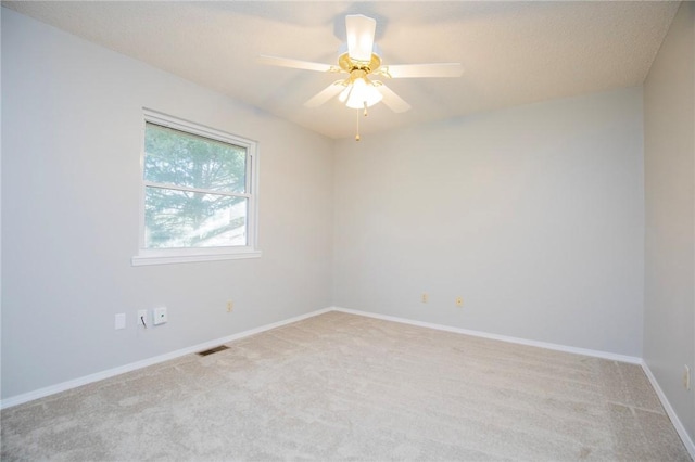 9 Cromer Dr, Bella Vista, AR 72715 - spare room featuring light colored carpet, baseboards, a ceiling fan, and visible vents
