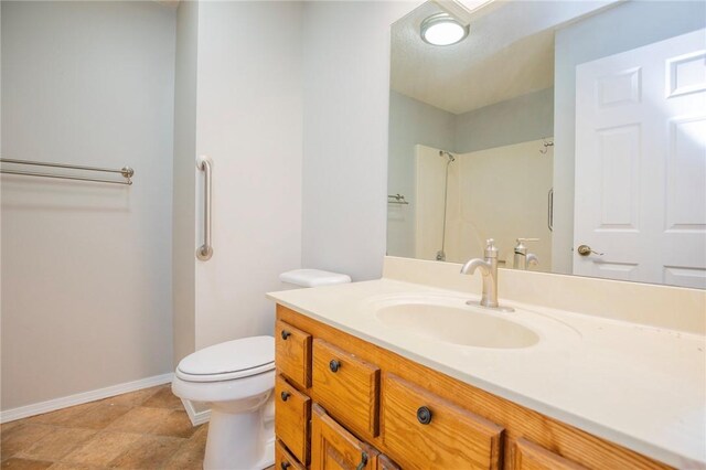 9 Cromer Dr, Bella Vista, AR 72715 - bathroom with toilet, vanity, and baseboards