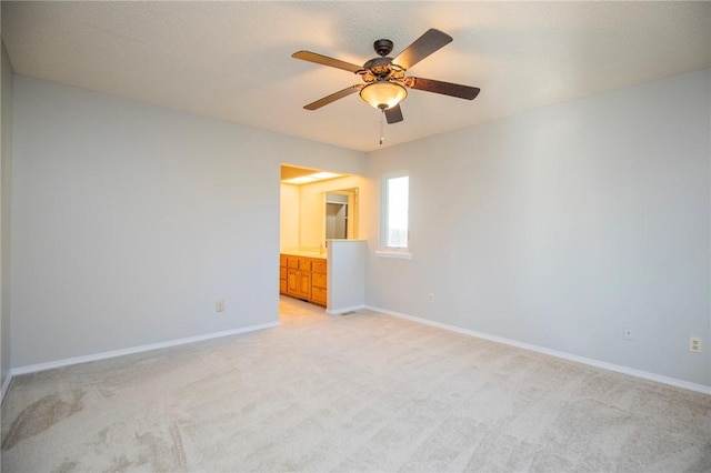 9 Cromer Dr, Bella Vista, AR 72715 - unfurnished bedroom with baseboards, a ceiling fan, light carpet, and a textured ceiling
