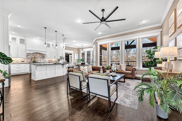 living area with ceiling fan, dark wood-style floors, ornamental molding, and recessed lighting