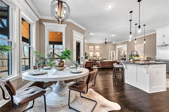 dining room with crown molding, recessed lighting, ceiling fan with notable chandelier, and dark wood-style flooring