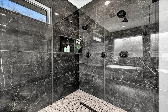 full bath with tiled shower