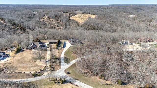 birds eye view of property with a forest view