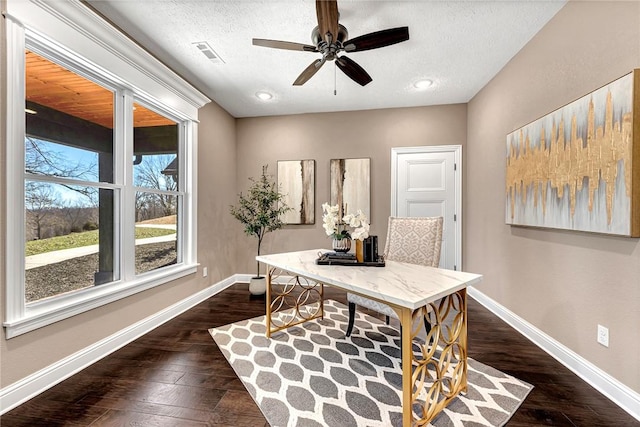 office featuring dark wood-style floors, visible vents, and baseboards