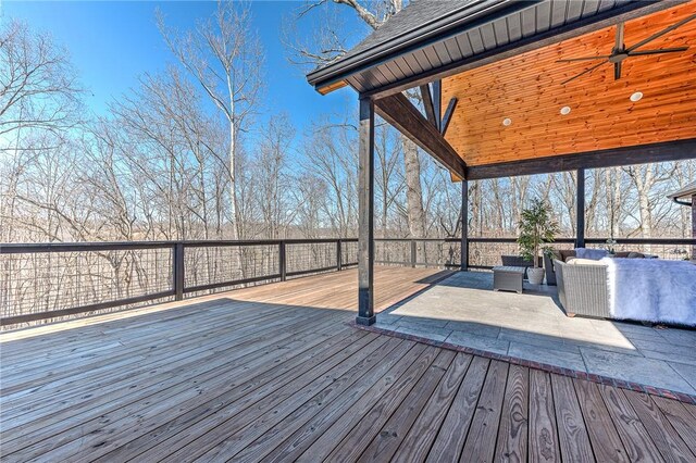 deck featuring an outdoor hangout area and ceiling fan