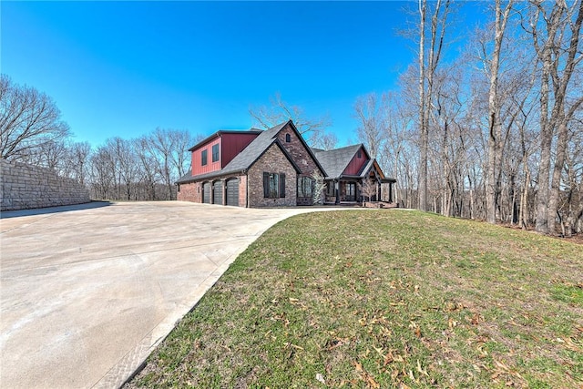 view of front facade featuring a garage, brick siding, concrete driveway, and a front yard