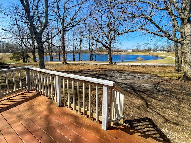 wooden deck featuring a water view