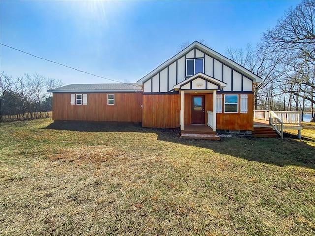 view of front facade featuring crawl space, a deck, and a front lawn