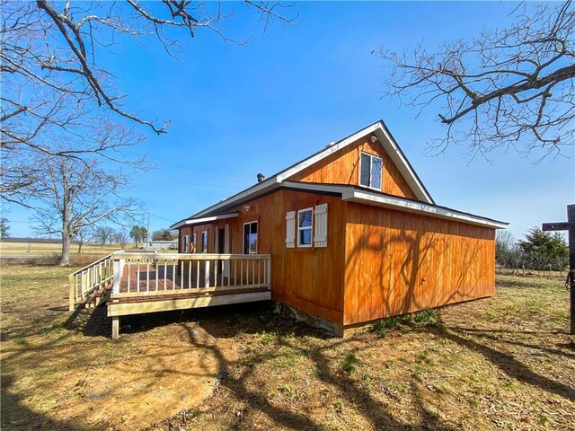 back of house featuring a deck