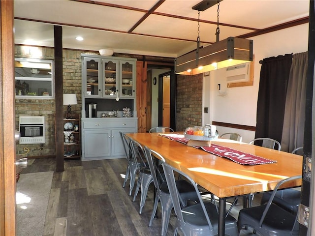1820 Oak Grove Rd, Van Buren, AR 72956 - dining area featuring heating unit, a glass covered fireplace, brick wall, and dark wood-type flooring