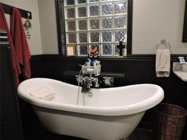 1820 Oak Grove Rd, Van Buren, AR 72956 - bathroom featuring wainscoting and a freestanding bath