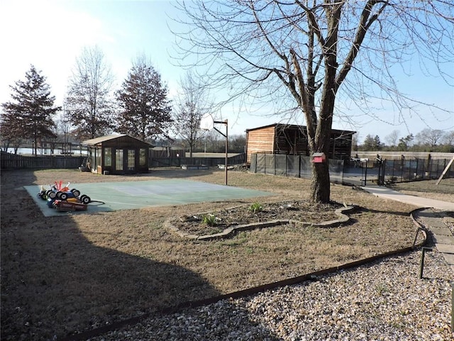 1820 Oak Grove Rd, Van Buren, AR 72956 - view of yard with an outdoor structure, fence, and community basketball court
