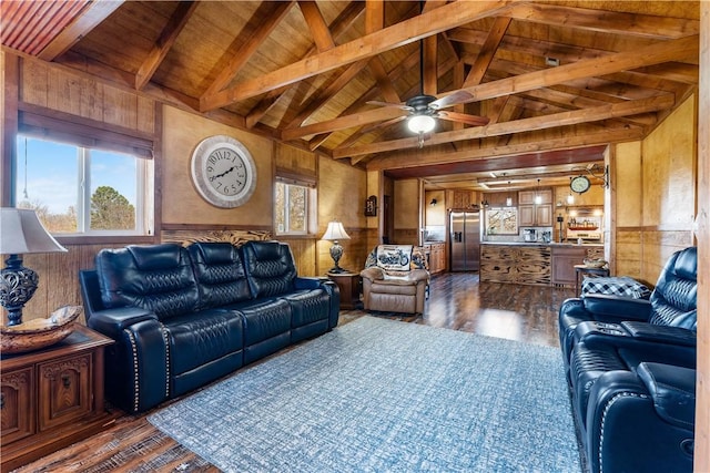 living area featuring ceiling fan, wooden walls, dark wood-style floors, and wainscoting