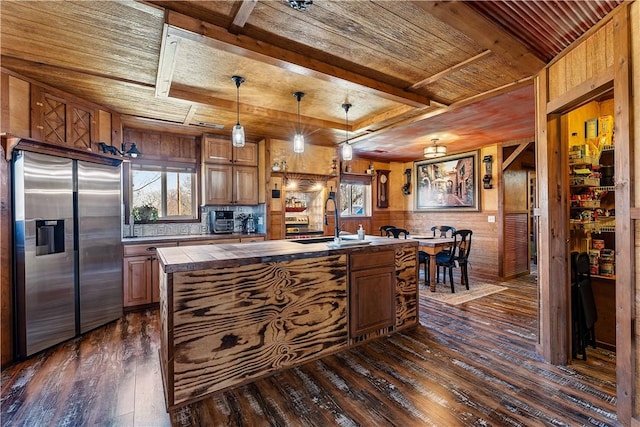 kitchen with a sink, dark wood-style floors, tile countertops, stainless steel fridge with ice dispenser, and wood ceiling