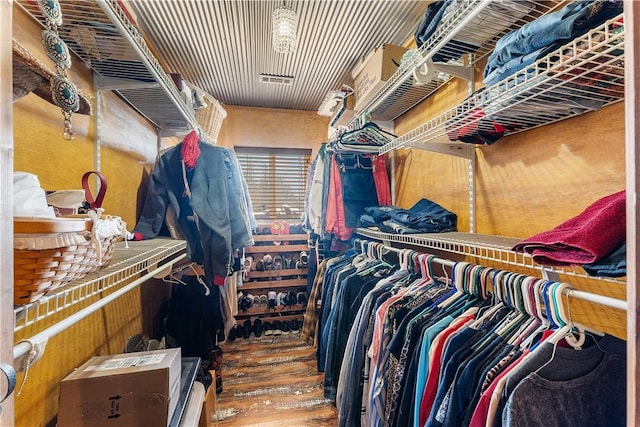 walk in closet with visible vents and wood finished floors