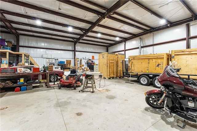 garage with a workshop area and metal wall