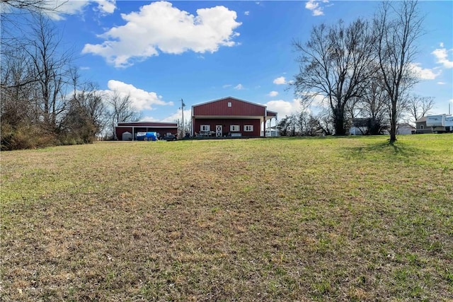 view of yard with an outbuilding and a pole building