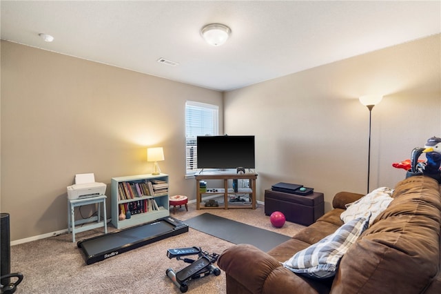 carpeted living room with visible vents and baseboards