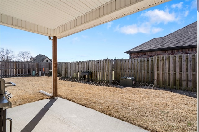 view of yard with a patio and a fenced backyard