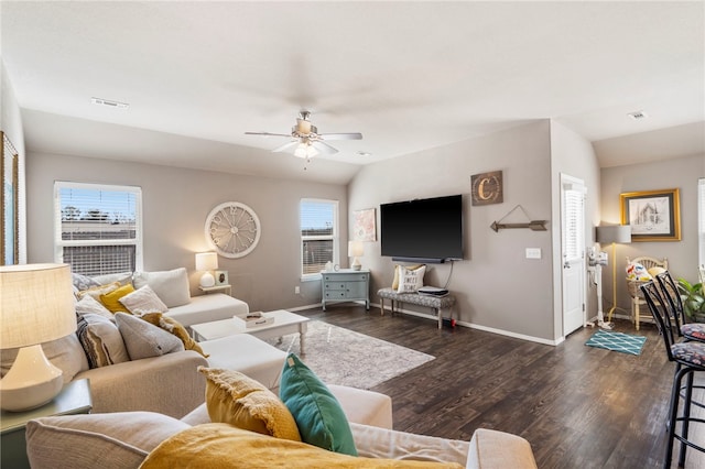 living area featuring dark wood-style flooring, baseboards, visible vents, and vaulted ceiling