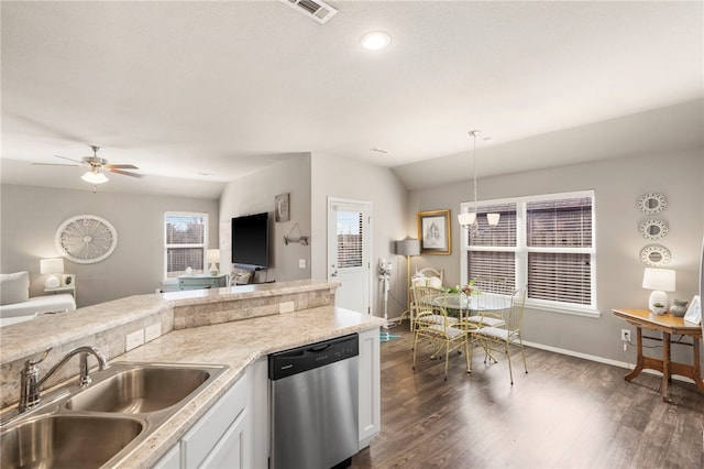 kitchen with dishwasher, open floor plan, visible vents, and a sink