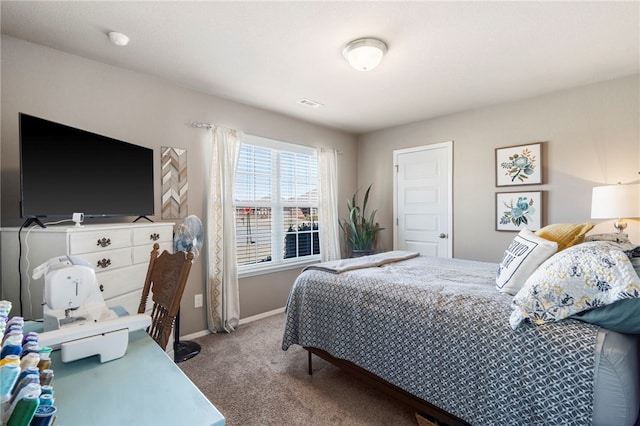 carpeted bedroom with visible vents and baseboards