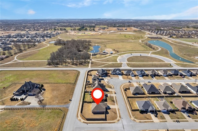 birds eye view of property with a residential view