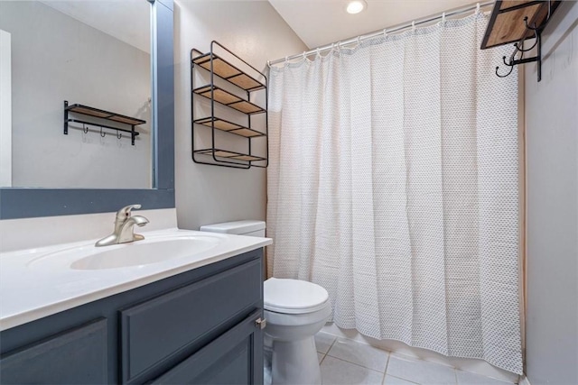 bathroom with tile patterned flooring, a shower with shower curtain, toilet, and vanity