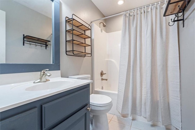 bathroom featuring tile patterned floors, shower / bath combo with shower curtain, vanity, and toilet