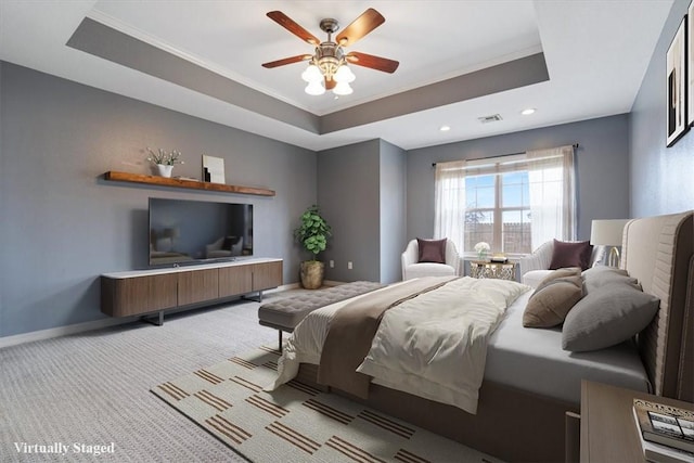 bedroom featuring recessed lighting, a raised ceiling, visible vents, ornamental molding, and light colored carpet