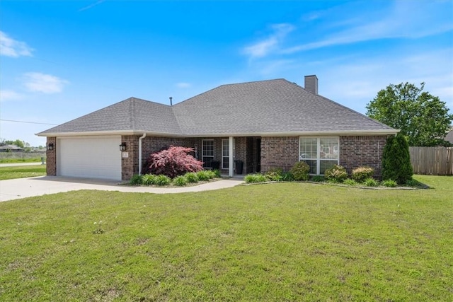 ranch-style home with an attached garage, a front lawn, fence, and brick siding