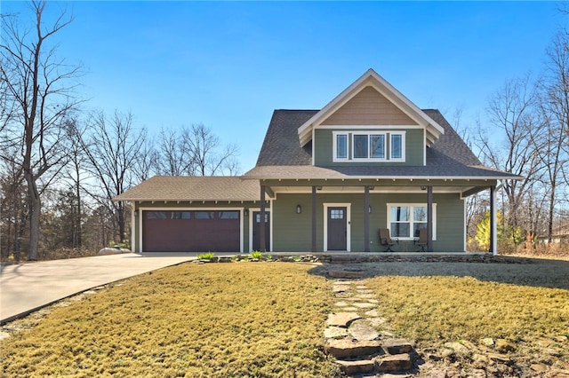 view of front of property with driveway, a porch, a shingled roof, a front yard, and an attached garage