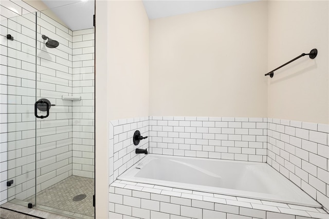 bathroom with a garden tub and a stall shower