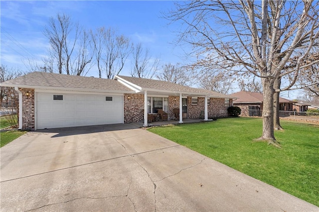 single story home with brick siding, a front lawn, fence, a garage, and driveway