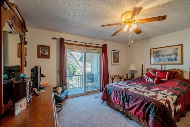 bedroom with access to outside, carpet floors, and a textured ceiling