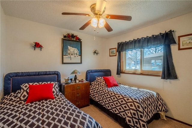 carpeted bedroom with baseboards, a textured ceiling, and ceiling fan