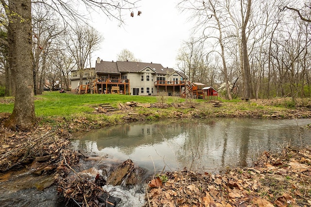 property view of water featuring stairway