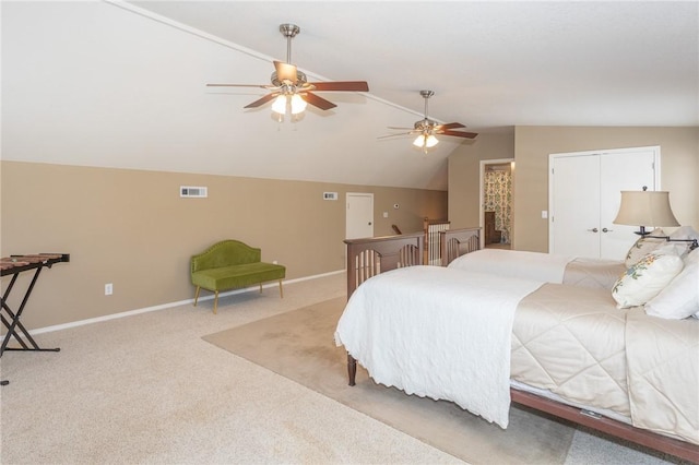 carpeted bedroom with visible vents, lofted ceiling, baseboards, and ceiling fan