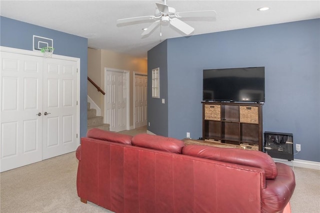 living room with carpet, baseboards, recessed lighting, ceiling fan, and stairs